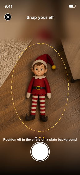Photographing your own elf lying on the floor, framed by the app's capture guide